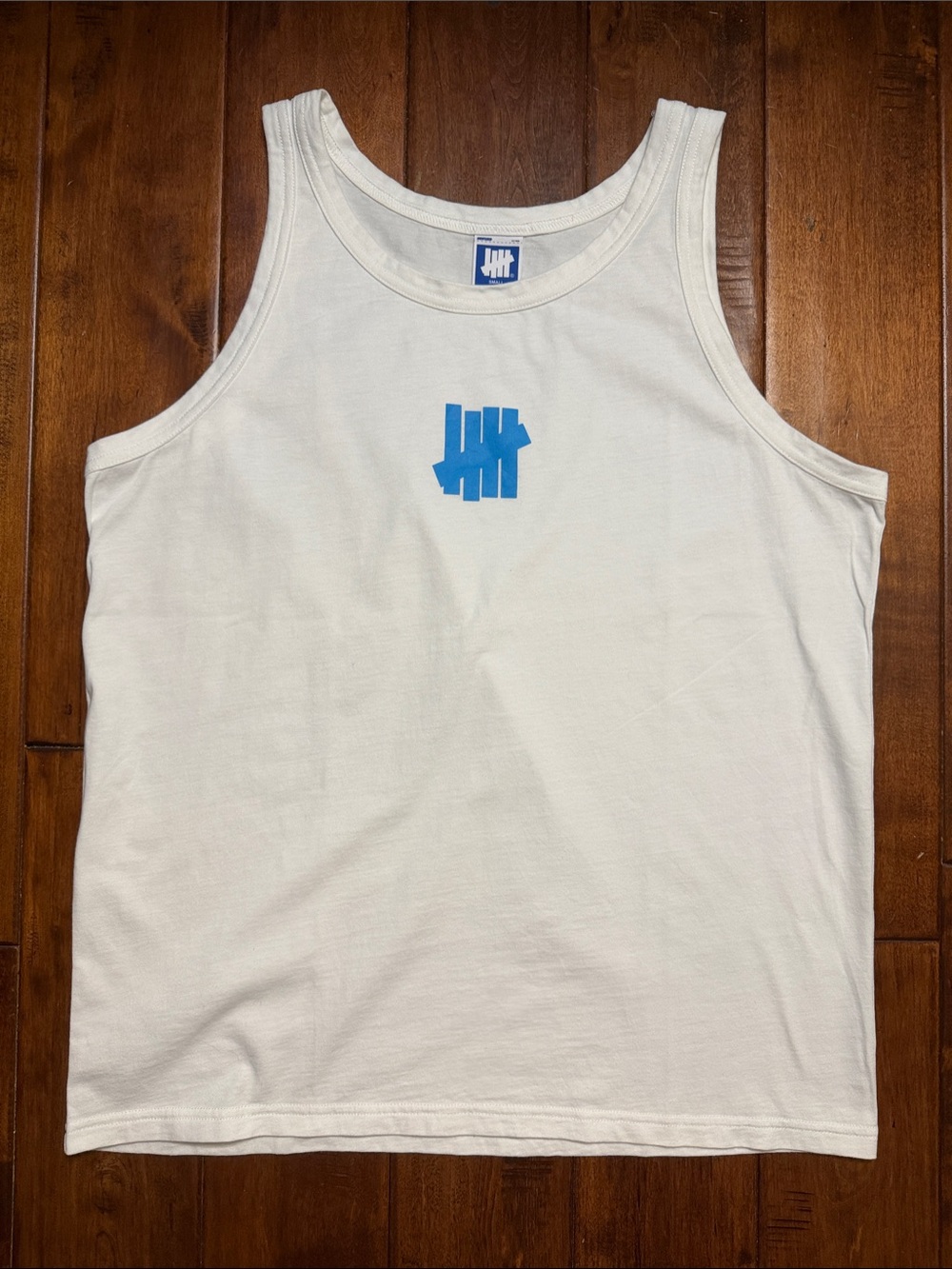 Undefeated White Tank with Blue Logo Center